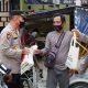 Polres Tapteng bagikan Bansos bagi warga terdampak penyesuaian harga BBM. (ist)