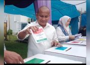 Sebelum Mencoblos di TPS 4 Kampung Solok Barus, Rahmansyah Sibarani Ziarah ke Makam Orang Tuanya